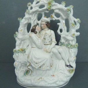 Antique Staffordshire flatback figure lovers in an arbour girl and boy 24 cms
