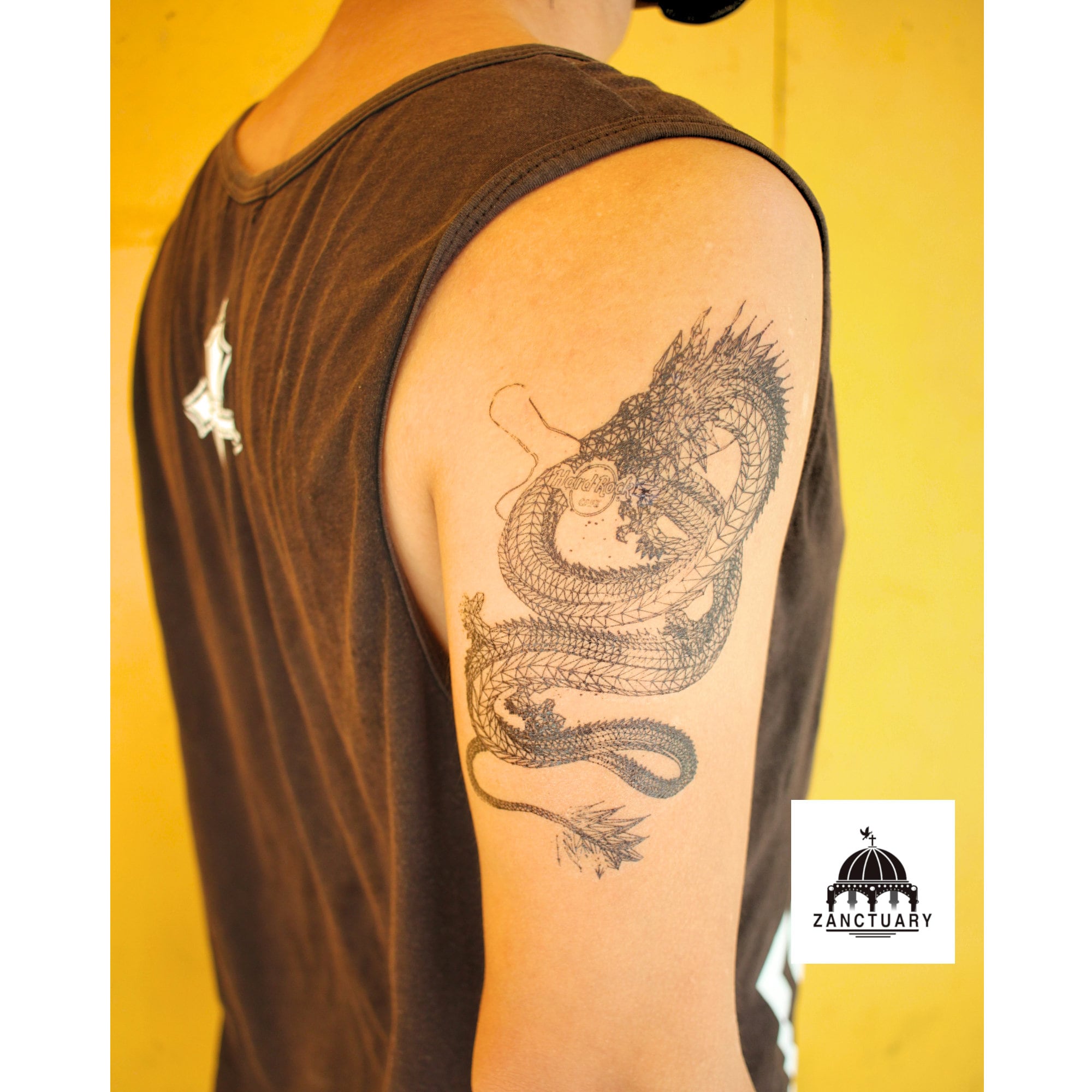 Dragon tattoo located on the inner forearm