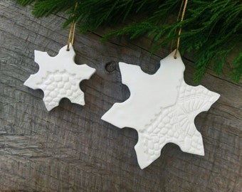 Set of 6 snowflake shaped ornaments with partially lace imprint