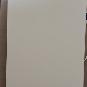 May include: A plain white sheet of paper.