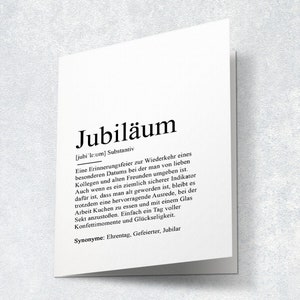 May include: A black and white printable definition card for the German word "Jubil&auml;um" which means "anniversary". The card defines the word as a celebration of a special date, often with colleagues and friends. It also mentions that it is a reminder of getting older, but a good excuse to have cake and champagne.