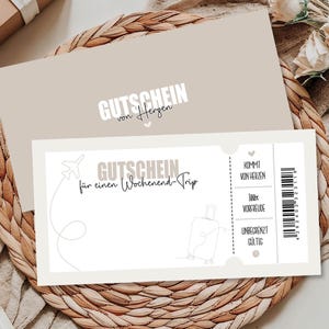 May include: A gift certificate with the text "GUTSCHEIN" and "f&uuml;r einen Wochenend-Trip" in a light beige color. The certificate features a drawing of an airplane and a suitcase. The background is a woven mat with flowers.