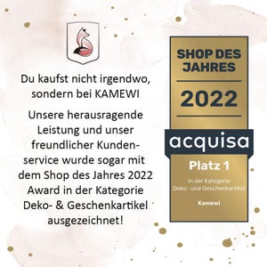 May include: A gold and black award certificate for Shop of the Year 2022, with the text "acquisa Platz 1" and "Deko- & Geschenkartikel". The image also includes the text "Du kaufst nicht irgendwo, sondern bei KAMEWI".