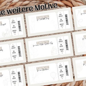 May include: A collection of light beige gift certificates with various designs and text in German. Each certificate features a unique illustration and the words "GUTSCHEIN" and "Viele weitere Motive". The certificates are arranged on a woven background.