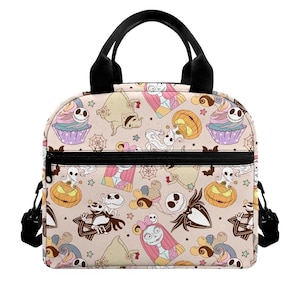 May include: A beige lunch bag featuring a repeating pattern of characters and icons from The Nightmare Before Christmas, including Jack Skellington, Sally, Zero, Oogie Boogie, pumpkins, cupcakes, spiderwebs, and stars, with black handles.