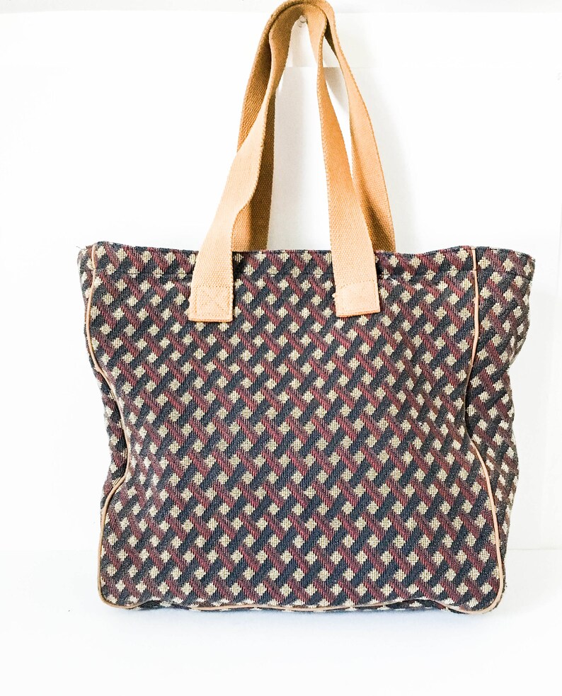 navy and tan handbag