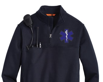 May include: A navy blue fleece pullover with a zippered neck and a patch on the left chest featuring a white medical symbol with a blue background. The patch has a snake wrapped around a staff.