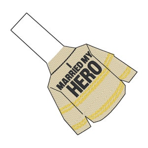 May include: A tan-colored shirt with the text "I MARRIED MY HERO" in black lettering. The shirt has yellow stripes and is designed to resemble a firefighter's uniform. The shirt is a unique gift idea.