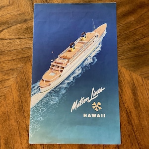 May include: Vintage travel brochure for Matson Lines, featuring a detailed illustration of a cruise ship sailing on blue water. The brochure has the words "Matson Lines" and "Hawaii" printed on it.