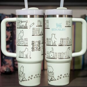 a couple of white cups sitting on top of a table