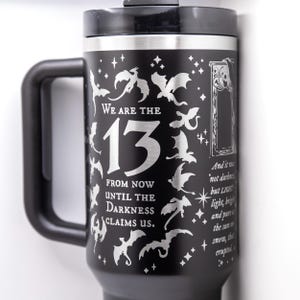 a travel mug with a design on it
