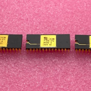 May include: Three black integrated circuits with gold pins and yellow labels. The labels read "Zilog 7-80A CTC 84307 A 7917 CS", "Zilog 7-80A CTC 8430Z A 7923 CS", and "Zilog 7-80A CTC 84307 A 7917 CS".