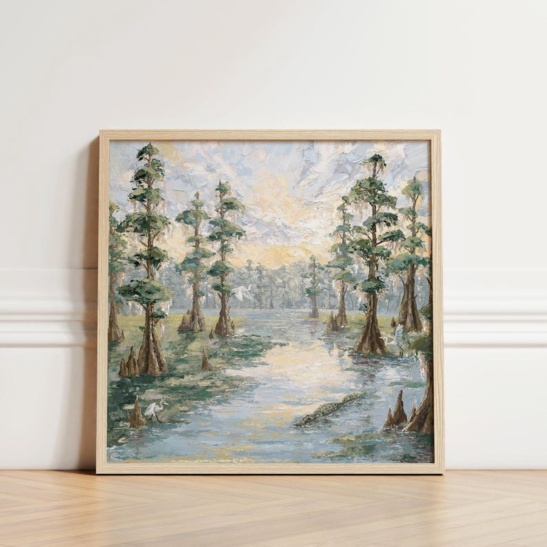 May include: Square framed oil painting of a swamp scene. The artwork depicts tall cypress trees with green foliage and textured bark, reflected in the water. The color palette includes greens, blues, and yellows, creating a serene landscape.