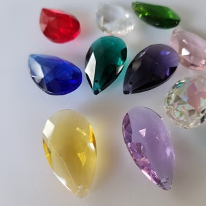 May include: Assortment of teardrop-shaped crystal prisms in various colors, including red, blue, green, purple, yellow, and clear.