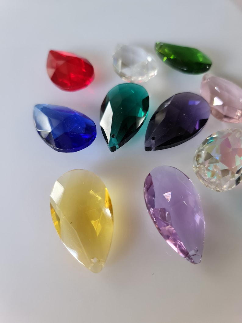 May include: Assortment of teardrop-shaped crystal prisms in various colors, including red, blue, green, purple, yellow, and clear.