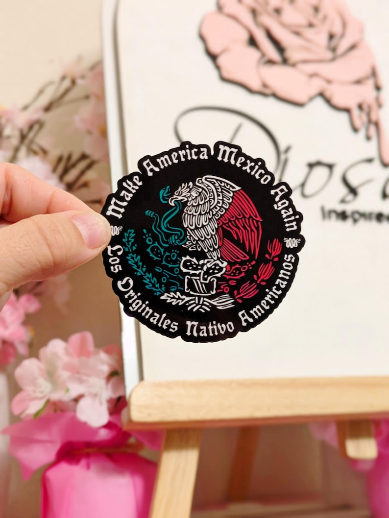 May include: A black and white sticker with a red, white, and green eagle design. The sticker says "Make America Mexico Again" and "Los Originales Nativo Americanos".