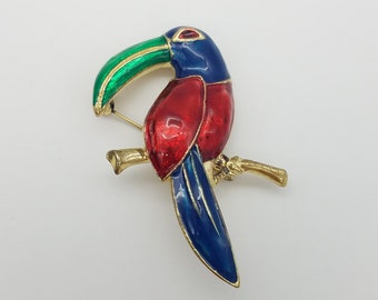 Vintage Red, Blue & Green Enamel Toucan Brooch on a Gold-Tone Background