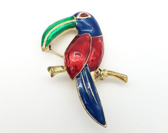 Vintage Red, Blue & Green Enamel Toucan Brooch on a Gold-Tone Background
