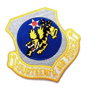 May include: A blue and yellow embroidered patch with a white star and a tiger in the center. The text "Fourteenth Air Force" is around the edge of the patch.