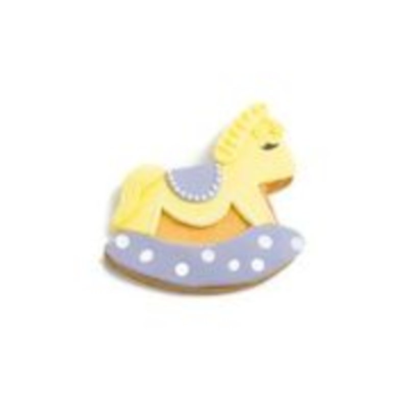 May include: A yellow rocking horse cookie decorated with white polka dots on a purple base.