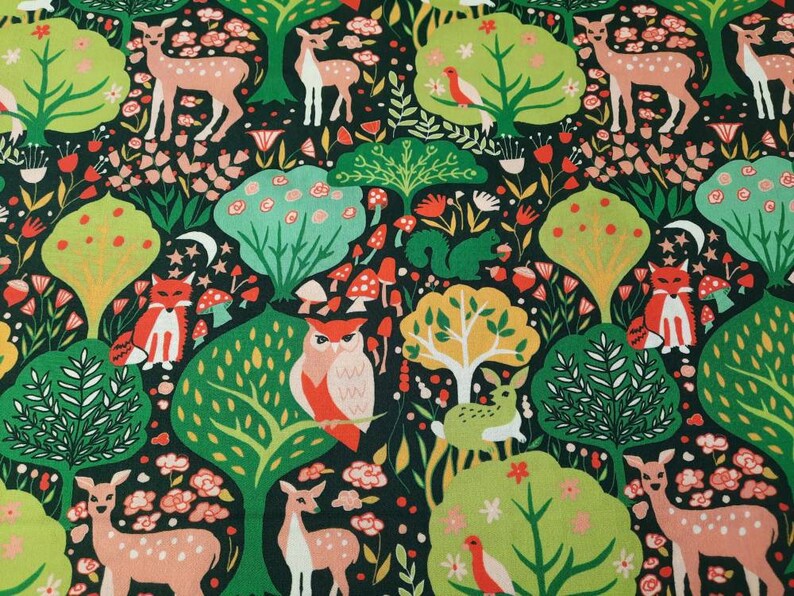 May include: A green, red, and pink fabric with a repeating pattern of owls, deer, foxes, and mushrooms. The background is a dark green color.