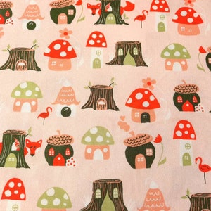 May include: A pink fabric with a repeating pattern of mushroom houses, tree stumps, and foxes. The houses are in various colors, including red, green, and brown. The tree stumps are brown and have a rough texture. The foxes are orange and have white tails.