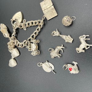 Vintage 925 Sterling Silver Charm Bracelet with 11 Charms - Weight 36g