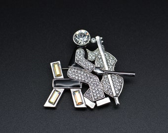 Vintage Butler Wilson Rhinestone Man Playing Base Brooch