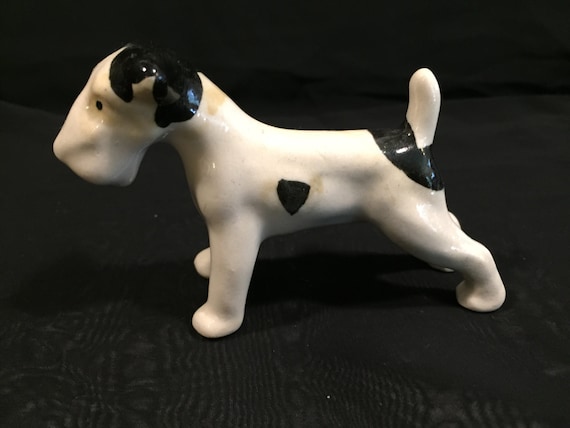 white porcelain dog figurines