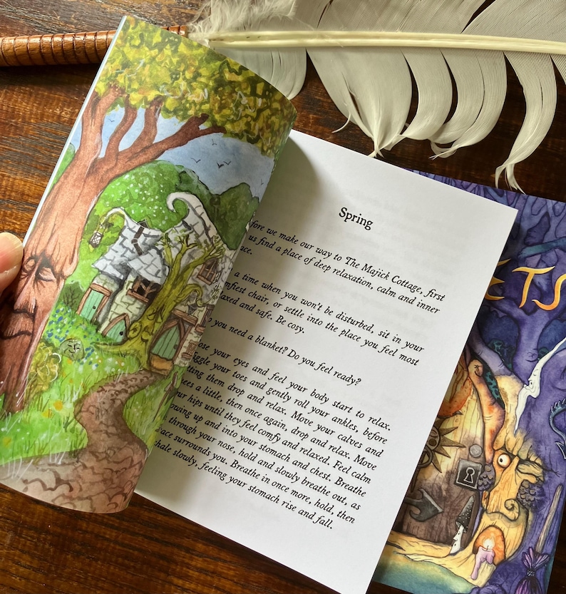 May include: An open book with colorful illustrations and text. The left page shows a whimsical cottage scene with a tree. The right page has the word "Spring" and relaxation instructions. A white feather rests nearby.