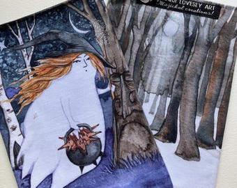May include: Two fabric pouches with whimsical illustrations. One features a witch with red hair, a black hat, and a cauldron. The other depicts a forest scene with the text "Jacqui Lovesey Art Majickal creations!"