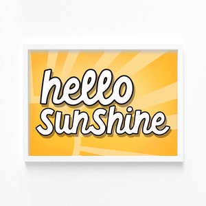 May include: A white framed print with a yellow background and sun rays. The text "hello sunshine" is written in white with a black outline.