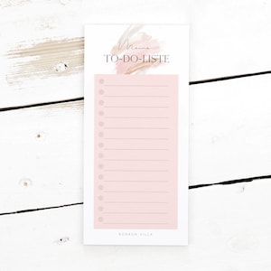 Könnte beinhalten: Ein rosa-beiger Notizblock mit der Aufschrift "Maine TO-DO-LISTE" und dem Namen "BONDON VILLA" am unteren Rand.