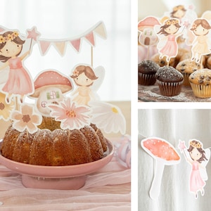 May include: A cake decorated with fairy-themed toppers, including fairies, mushrooms, and flowers. The cake sits on a pink pedestal, creating a whimsical and festive atmosphere, ideal for a celebration.
