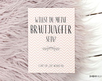 May include: A pink and white card with a chevron pattern. The card says "Willst du meine Brautjungfer sein?" in black text. The text "I can't say, "I do" without you" is printed in black text at the bottom of the card.