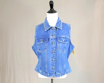 May include: A medium blue denim vest featuring a classic collar, a front button-down closure with metallic buttons, and two chest pockets with buttoned flaps. The sleeveless garment has vertical seam detailing and a structured, fitted silhouette.