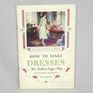 May include: A vintage booklet titled "How to Make Dresses The Modern Singer Way" with a cover image of a woman in a white dress standing in a room with a sewing machine. The booklet is published by Singer Sewing Machine Co. and costs 25 cents.