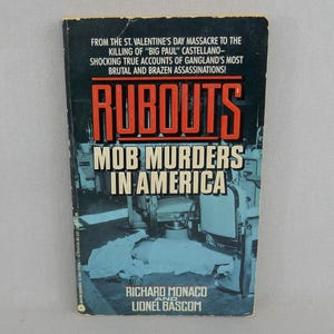 May include: A vintage paperback book titled "Rubouts: Mob Murders in America." The cover features the title in bold orange letters, with the subtitle in white. The background shows a crime scene with a body covered in a sheet.