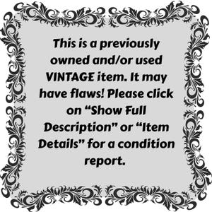 May include: A light gray rectangular sign with a black ornate floral border. The text reads: This is a previously owned and/or used VINTAGE item. It may have flaws! Please click on &ldquo;Show Full Description&rdquo; or &ldquo;Item Details&rdquo; for a condition report.