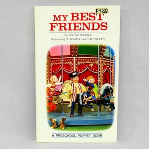 May include: A vintage children's book titled "MY BEST FRIENDS" by Oscar Weigle. The cover features a carousel scene with puppet figures and the text "A PRESCHOOL PUPPET BOOK". The price is $1.50.