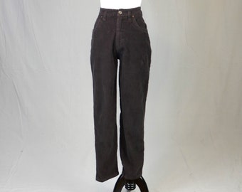 May include: High-waisted dark brown corduroy pants featuring a straight-leg cut, a button and zipper fly closure, two front pockets, and a textured ribbed fabric finish. These trousers have a structured waistband and a classic five-pocket design.
