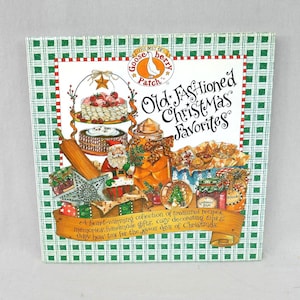 May include: A cookbook titled "Old Fashioned Christmas Favorites" with a green and white checkered border. The cover features illustrations of Christmas treats, Santa Claus, and jars of preserves. The text includes "Gooseberry Patch".
