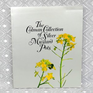 May include: A book cover featuring the text "The Colman Collection of Silver Mustard Pots" and a floral illustration of yellow flowers and green stems. The background is a light grey colour.