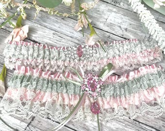 Conjunto de liga nupcial de encaje romántico rosa y salvia