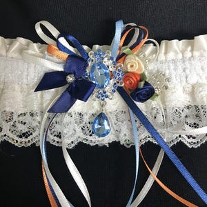 Keepsake wedding garter in navy, ivory, medium blue and burnt orange. Fall wedding garter.