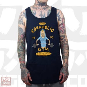 May include: A navy blue tank top with a cartoon character lifting weights. The text on the tank top reads "The Great Cornholio 1993 Gym I Am The Great!"