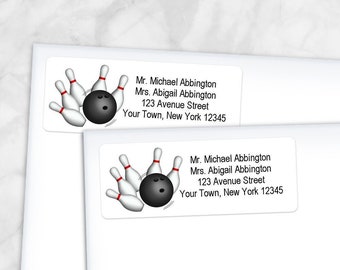 May include: A white address label with a bowling ball and pins graphic. The label has the text "Mr. Michael Abbington, Mrs. Abigail Abbington, 123 Avenue Street, Your Town, New York 12345".