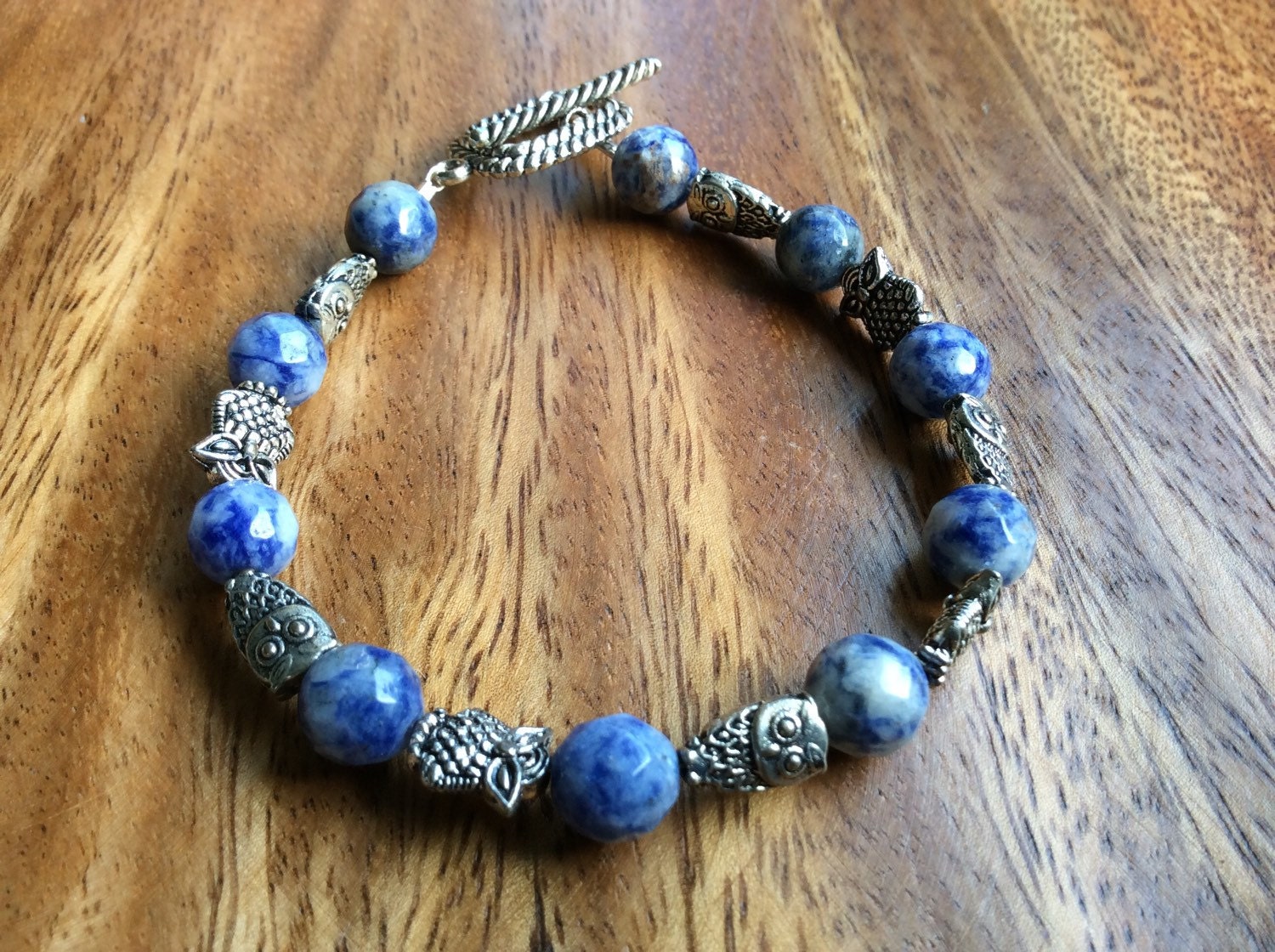 Blue & Silver Owls, beaded bracelet, denim color with silver accents.