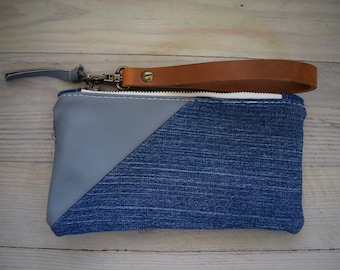 denim and gray leather wristlet