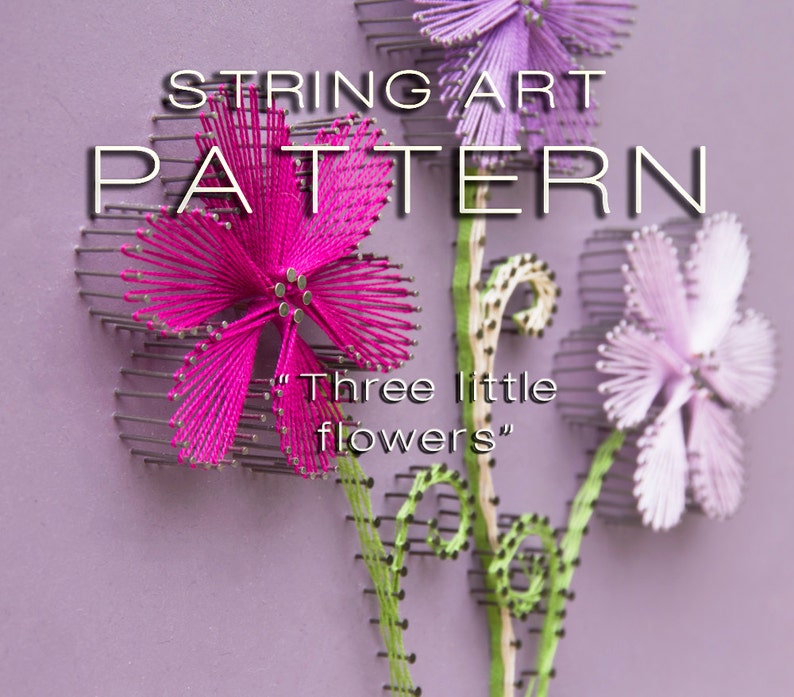 May include: A string art pattern featuring three stylized flowers in shades of pink and purple, with green stems and the text "Three little flowers". The flowers are made with thread wrapped around nails on a purple background.